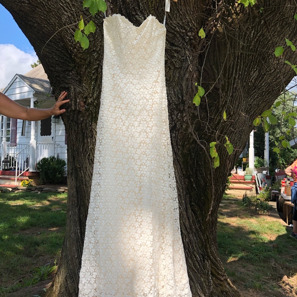 NWT. Never worn. Lace, strapless, wedding gown.